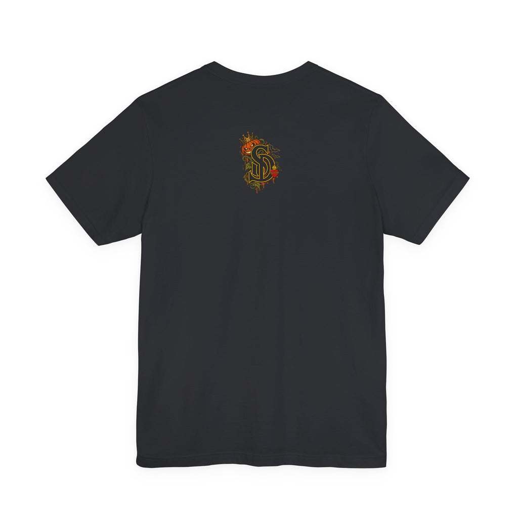 The Pumpkin Kingpin Tee product mockup with crowned jack-o'-lantern holding a No Rules Only Loyalty sign