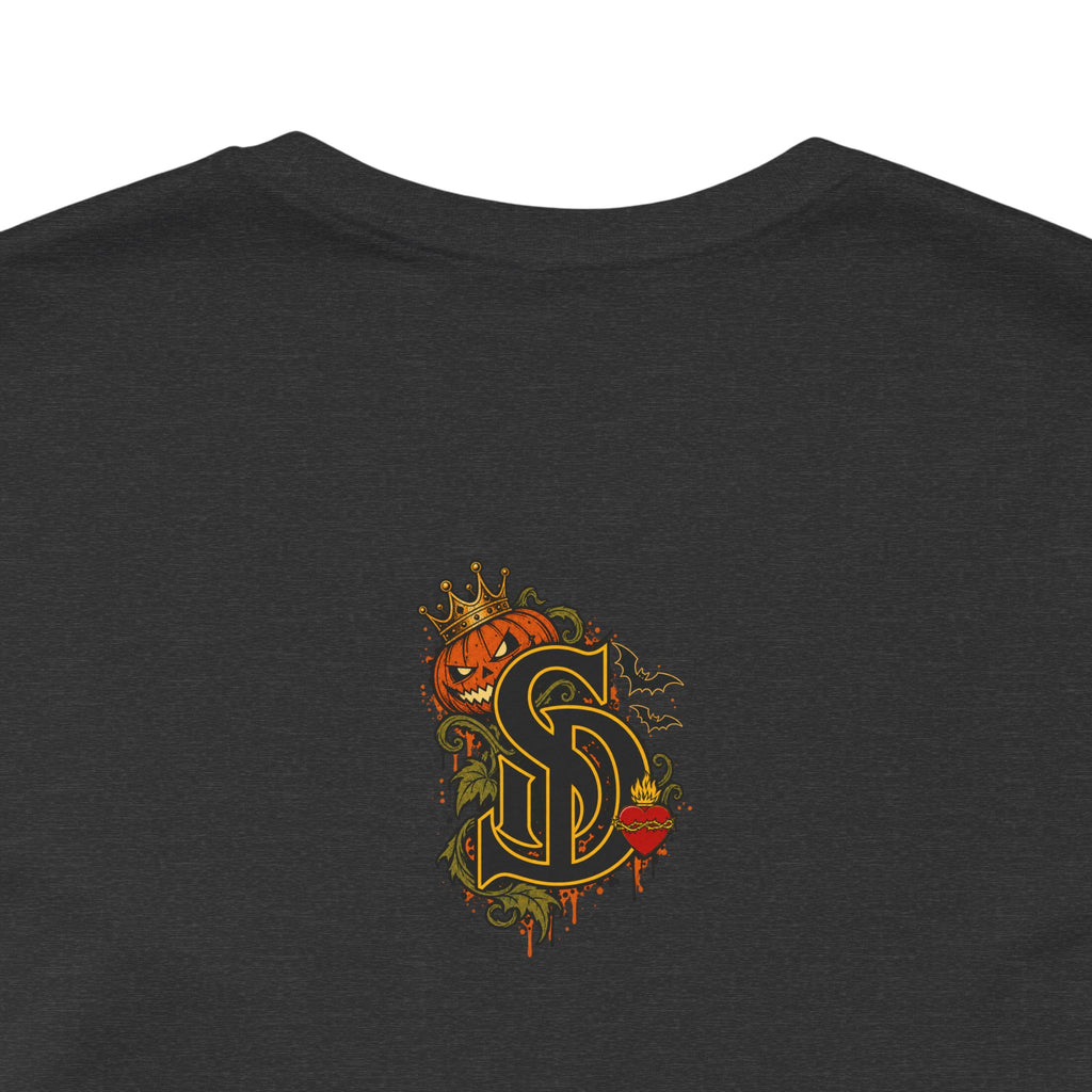 The Pumpkin Kingpin Tee product mockup with crowned jack-o'-lantern holding a No Rules Only Loyalty sign