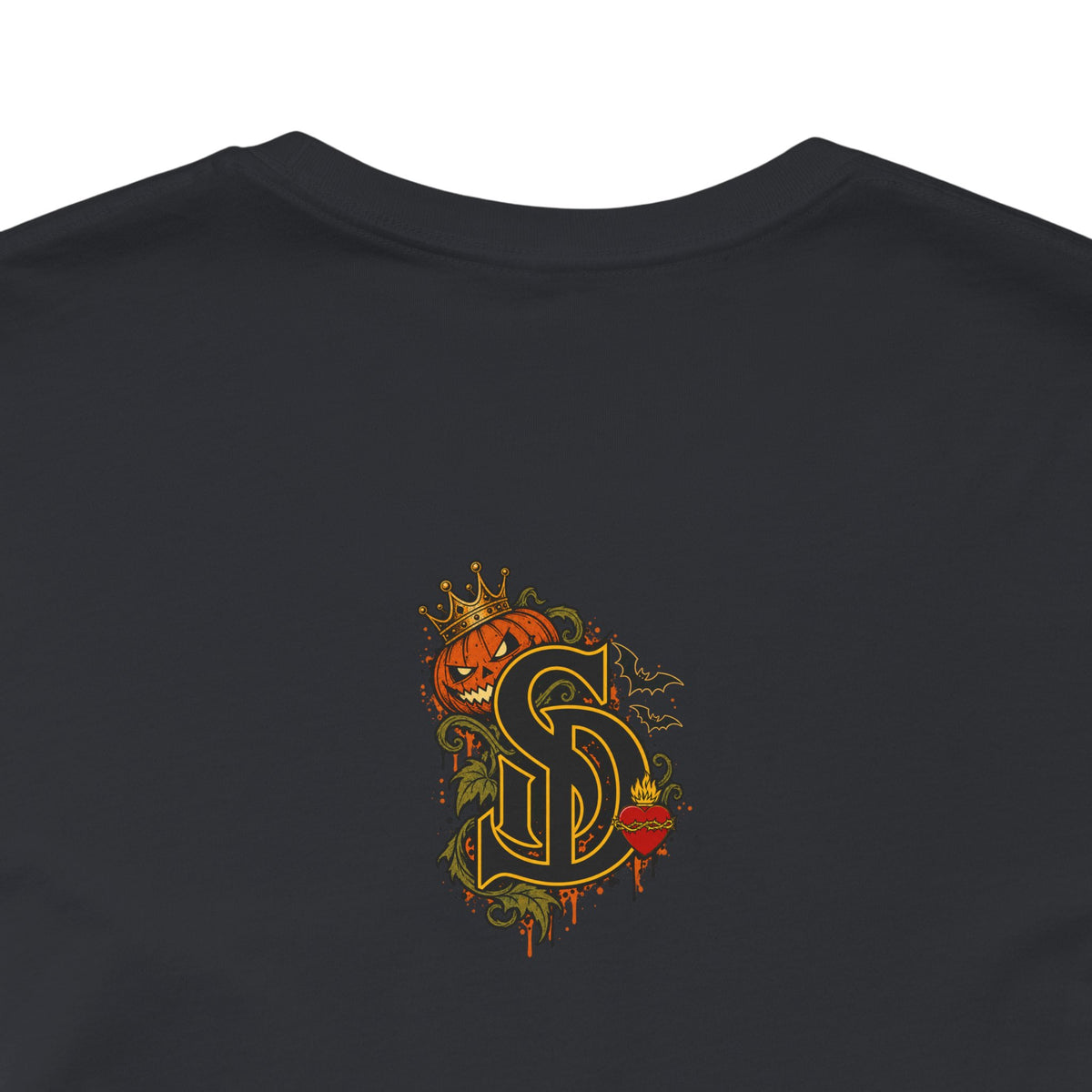The Pumpkin Kingpin Tee product mockup with crowned jack-o'-lantern holding a No Rules Only Loyalty sign