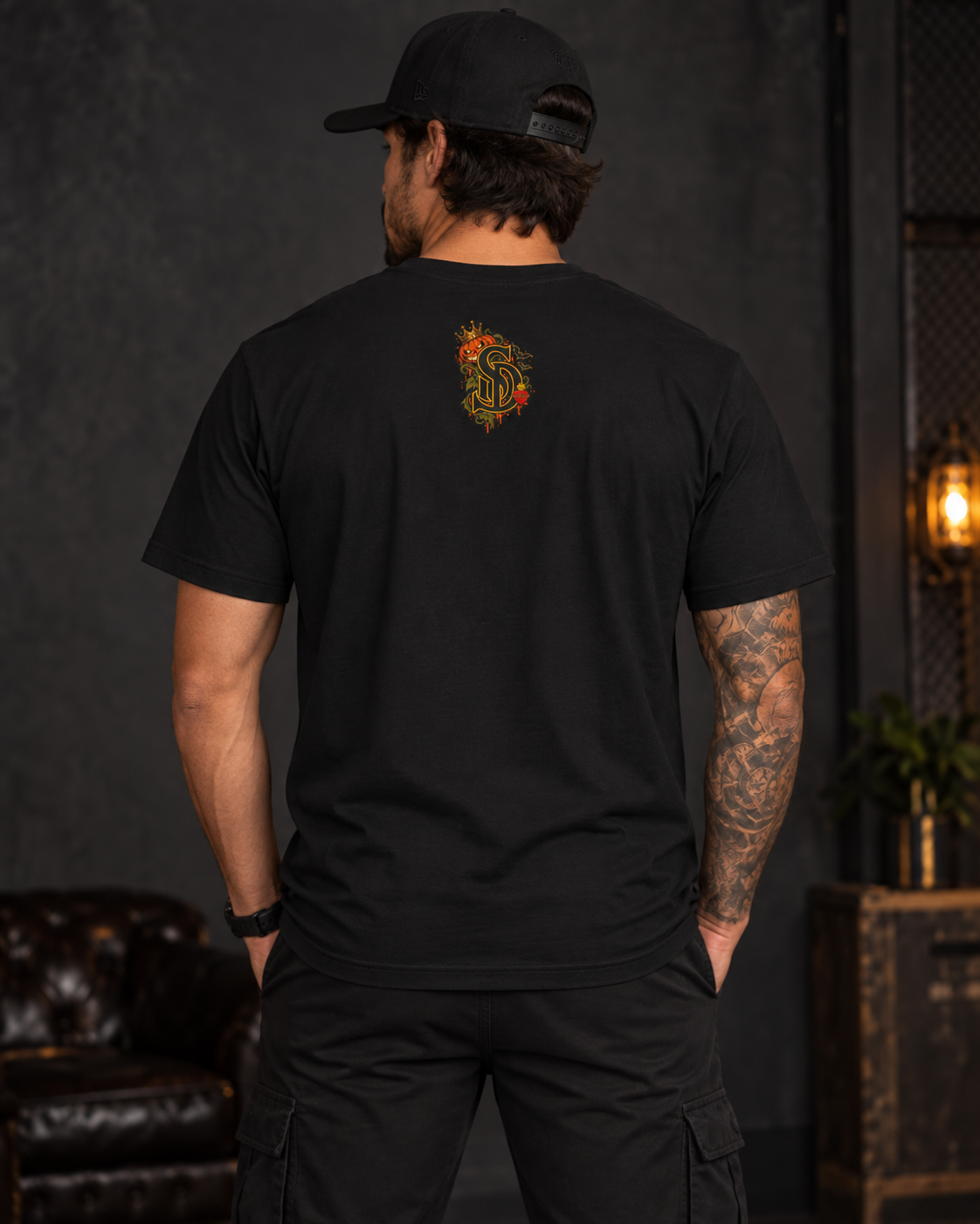 The Pumpkin Kingpin Tee styled product image with crowned jack-o'-lantern holding a No Rules Only Loyalty sign