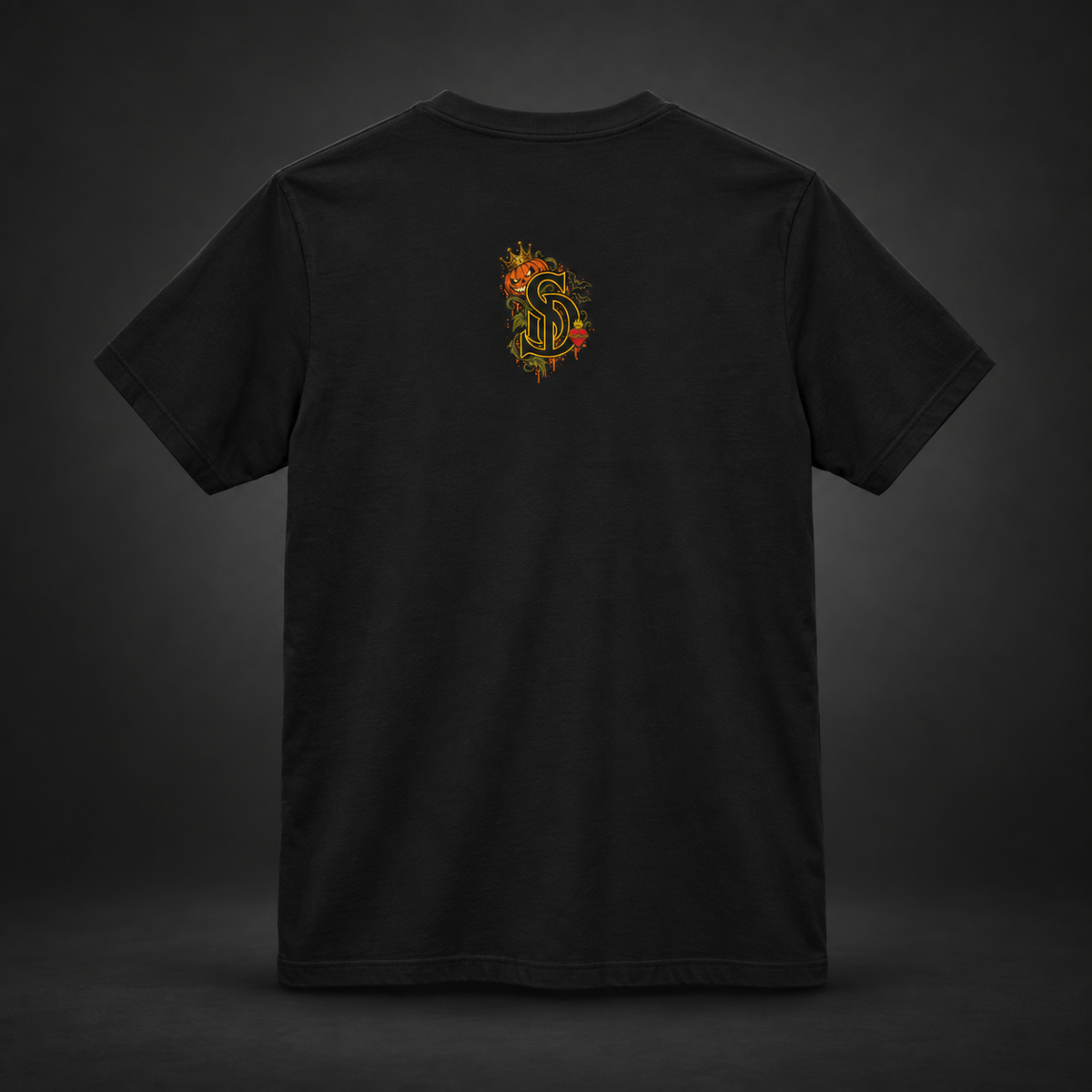 The Pumpkin Kingpin Tee styled product image with crowned jack-o'-lantern holding a No Rules Only Loyalty sign