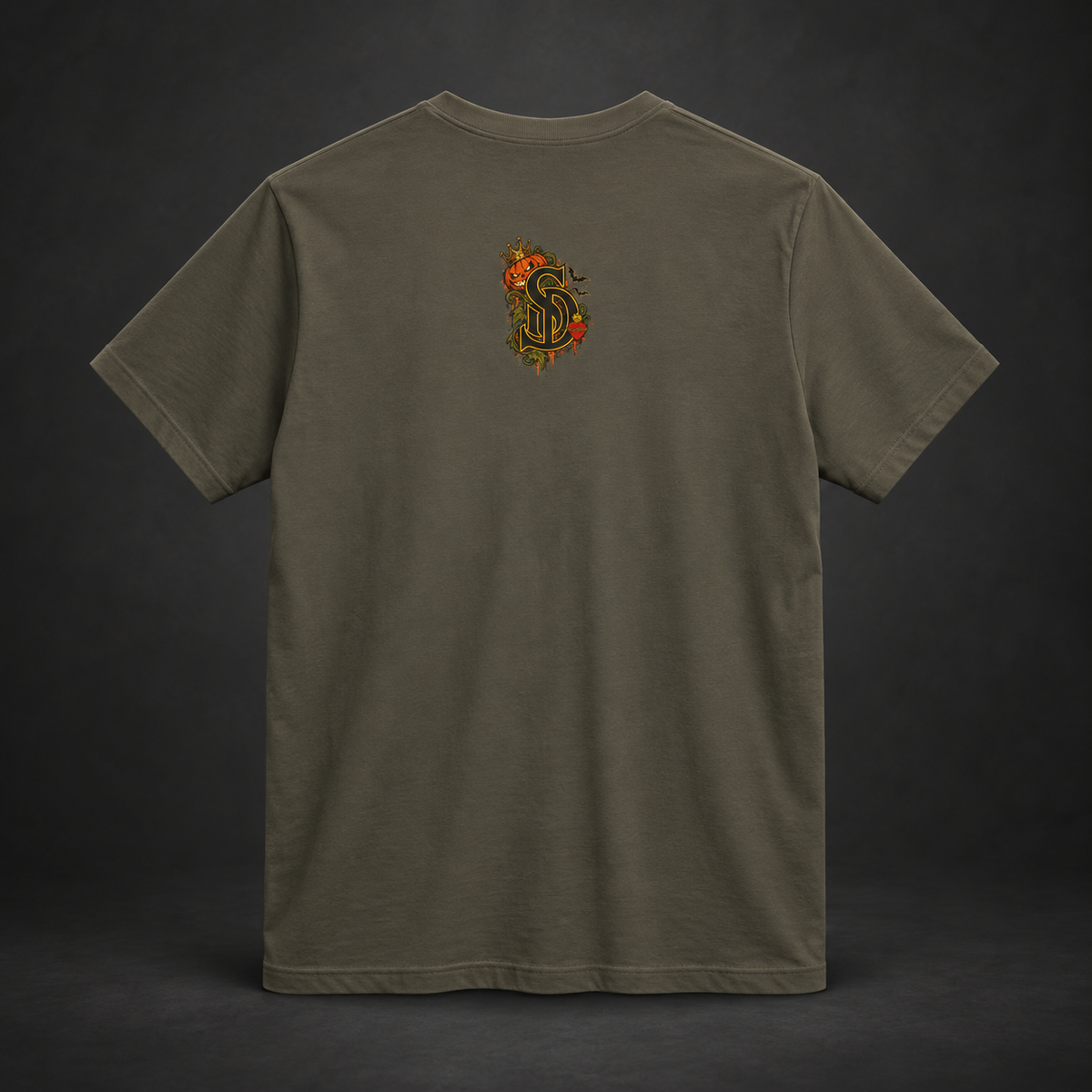The Pumpkin Kingpin Tee styled product image with crowned jack-o'-lantern holding a No Rules Only Loyalty sign
