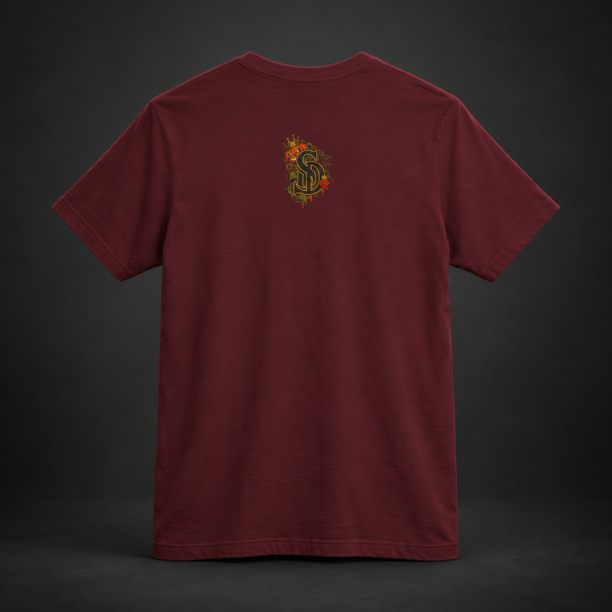 The Pumpkin Kingpin Tee styled product image with crowned jack-o'-lantern holding a No Rules Only Loyalty sign
