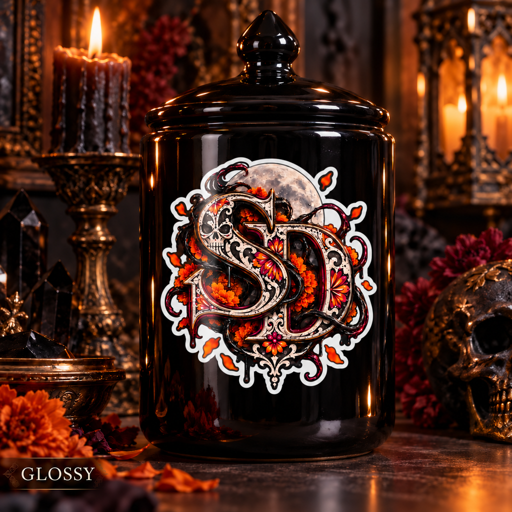 Glossy Día de los Muertos SD decal with a white border on a black glass jar.