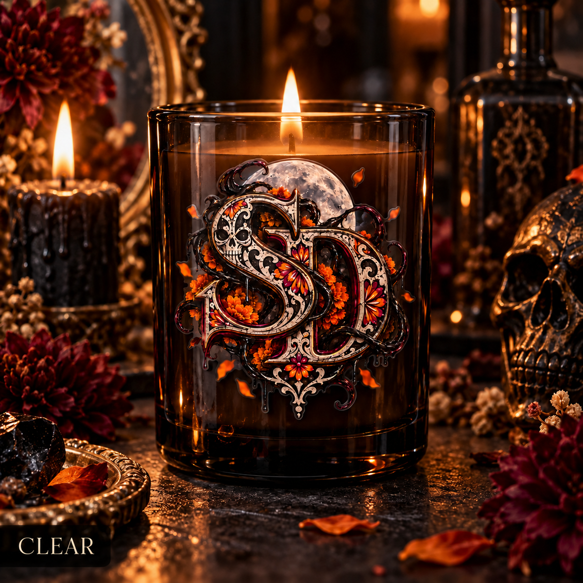 Clear Día de los Muertos SD decal on an amber candle vessel in a gothic setting.