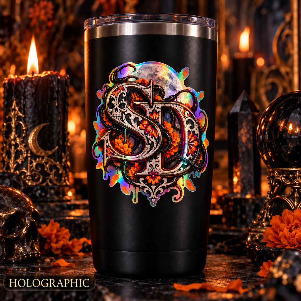 Holographic Día de los Muertos SD decal displayed on a black tumbler in a candlelit gothic scene.