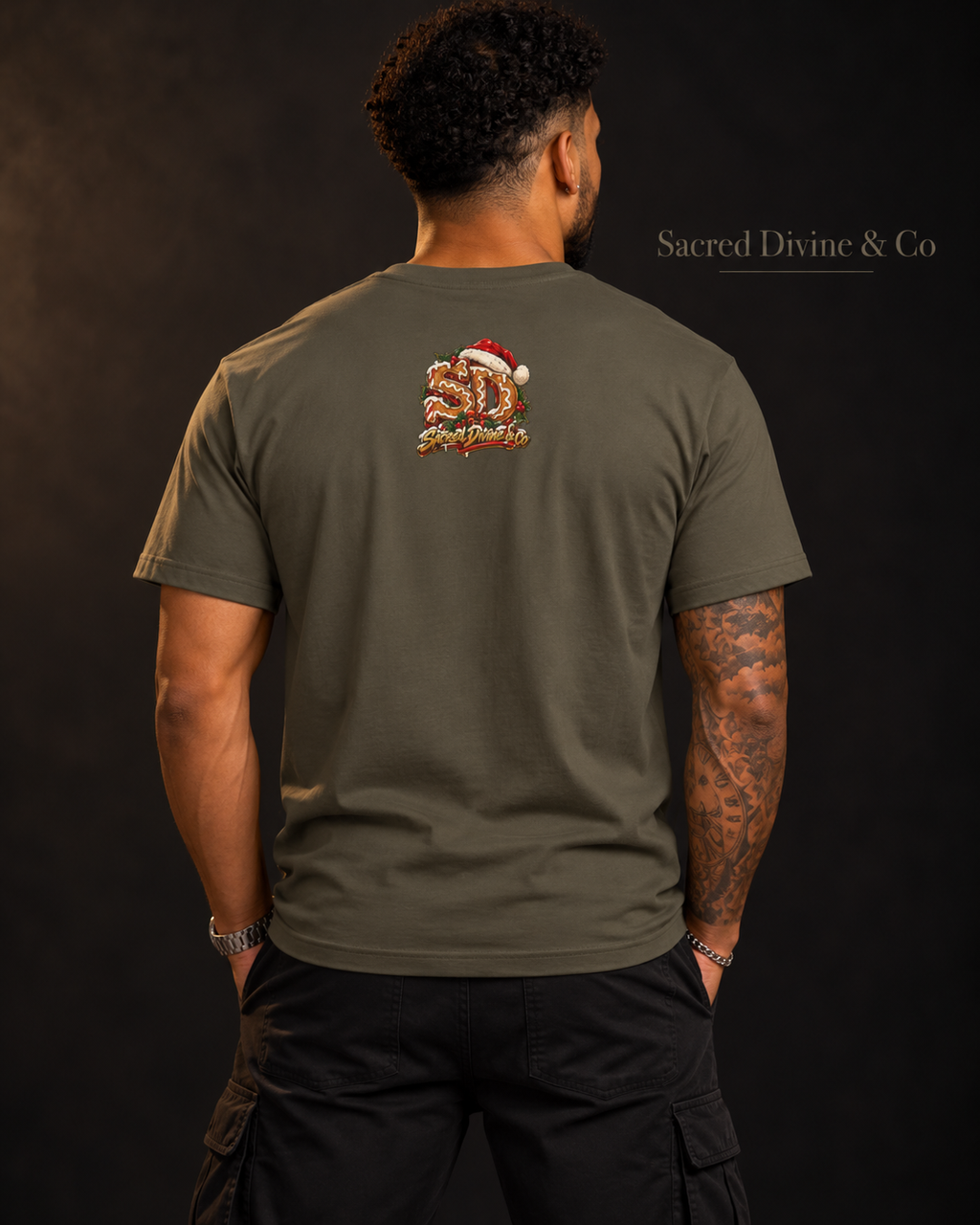Model wearing an Army Gingerbread Outlaw Tee, back view with a holiday SD mark.