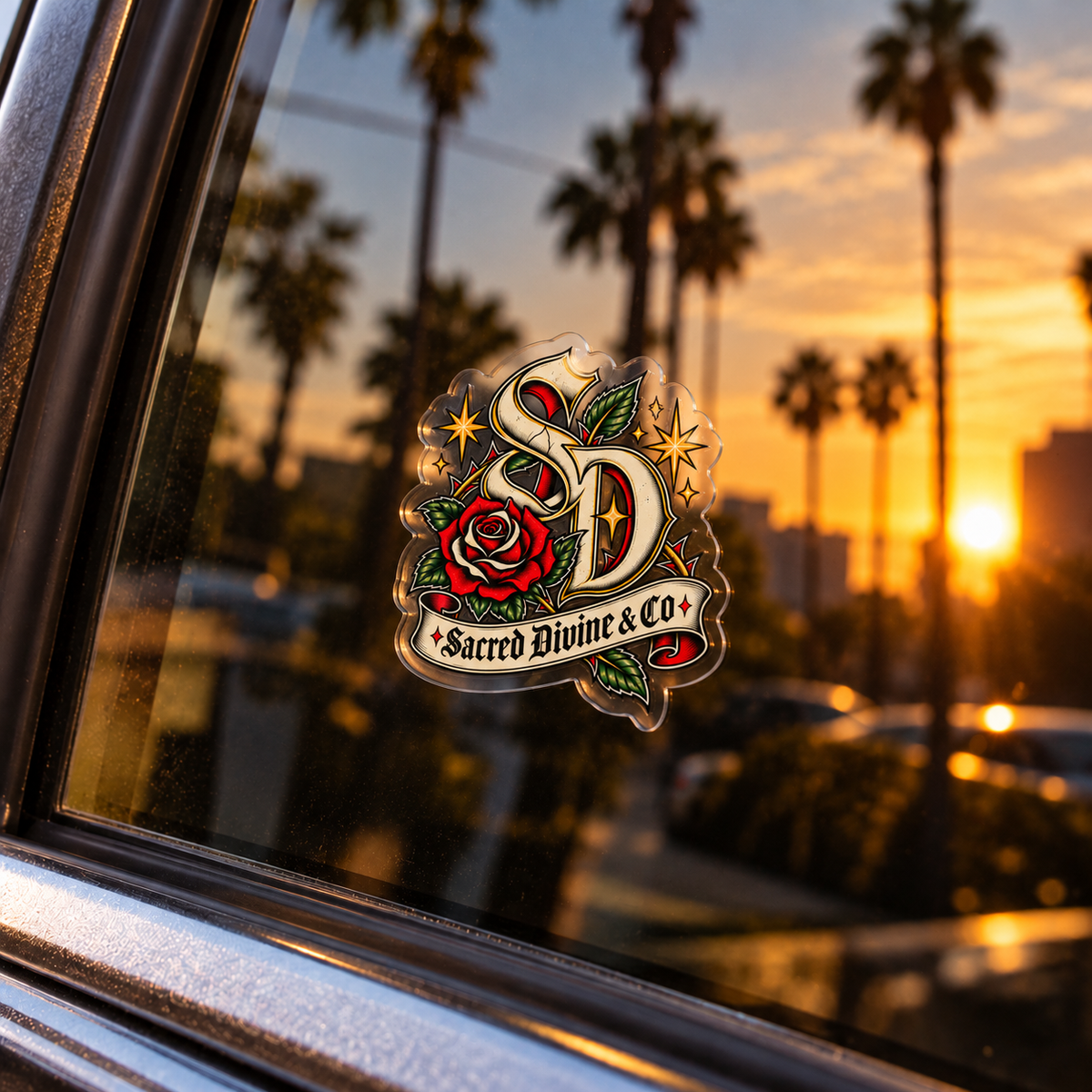 Gallery image 2: Sacred Divine Rose Monogram Decal featuring Sacred Divine SD monogram, red rose, green leaves, and gold stars.