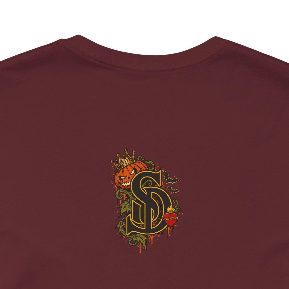 The Pumpkin Kingpin Tee product mockup with crowned jack-o'-lantern holding a No Rules Only Loyalty sign
