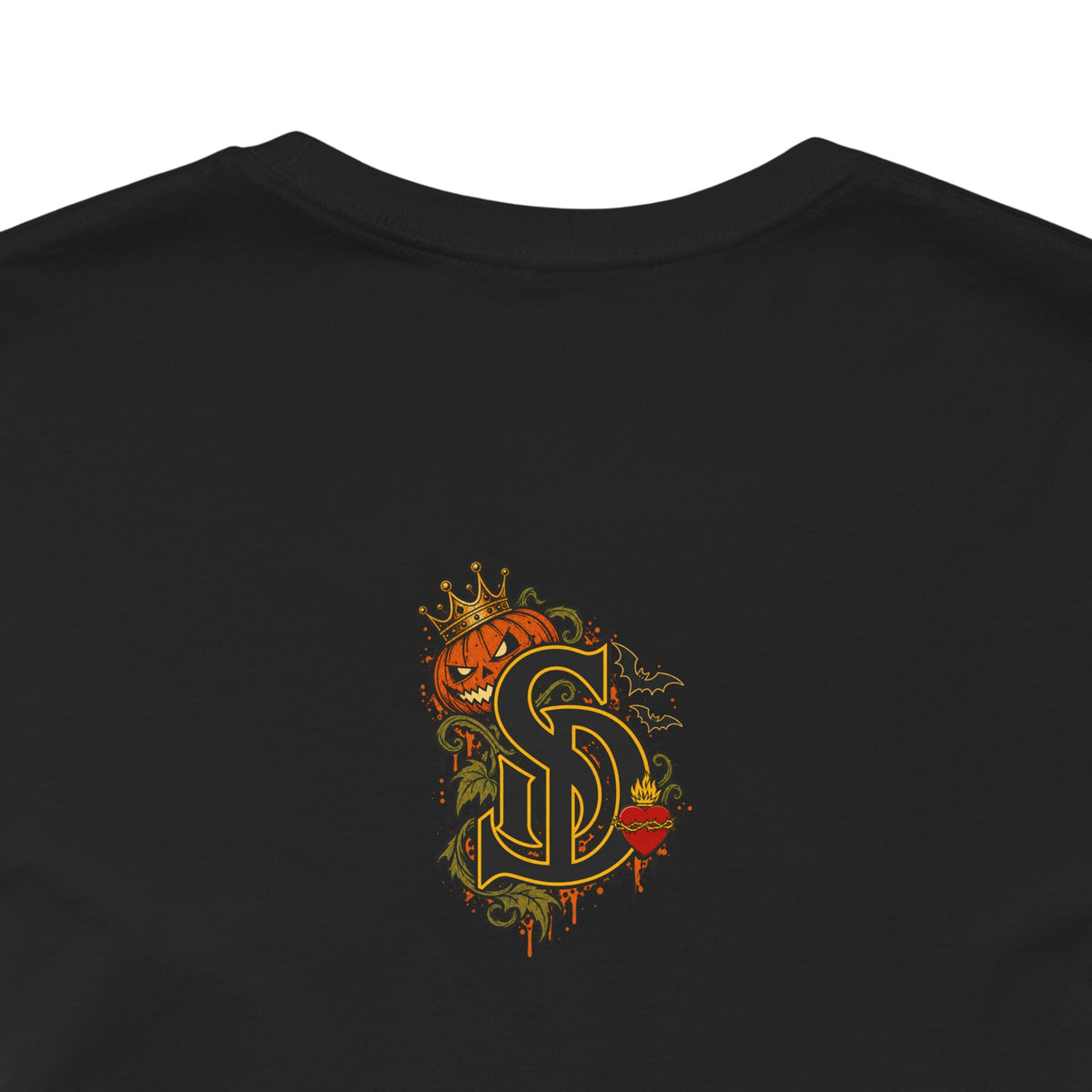 The Pumpkin Kingpin Tee product mockup with crowned jack-o'-lantern holding a No Rules Only Loyalty sign