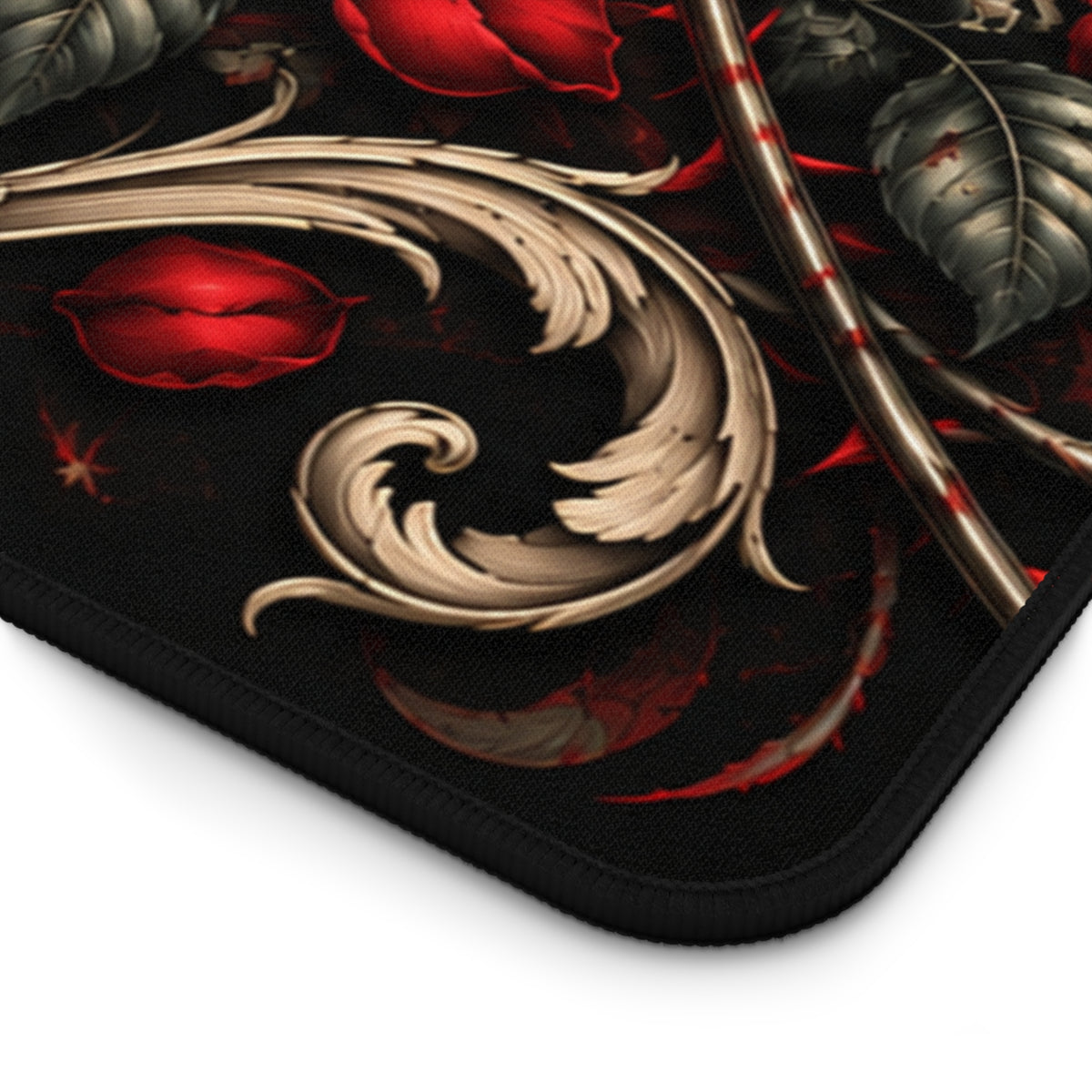 Close-up of the dark textured backing and rounded stitched edge of the Gothic Skull and Red Roses desk mat.