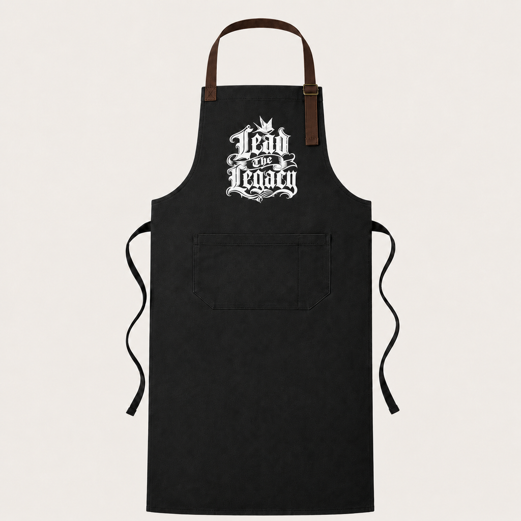 Sacred Divine & Co. Lead the Legacy Gothic Crest Bib Apron — Dark Luxury Kitchen & Grill