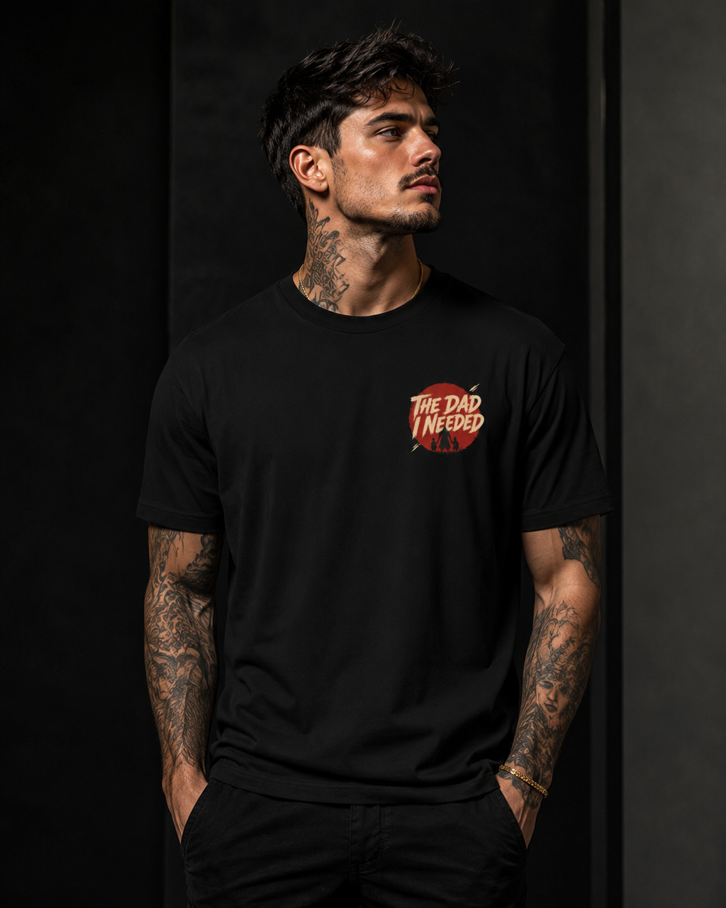 Built Different Tee black front lifestyle — model wearing tee with The Dad I Needed red circle left chest badge