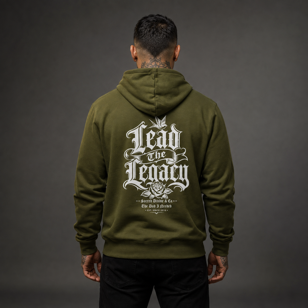 Lead the Legacy Hoodie army green back lifestyle — model wearing hoodie with Lead the Legacy gothic script full back graphic and Sacred Divine & Co. wordmark