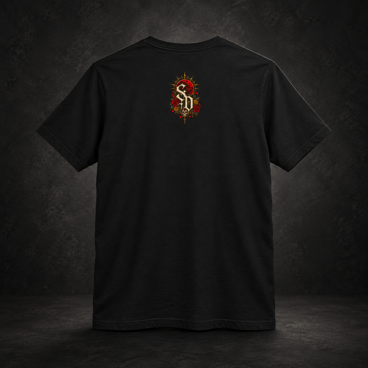 Catrina After Midnight Tee styled product image with Catrina sugar-skull artwork, crimson roses, and red sun